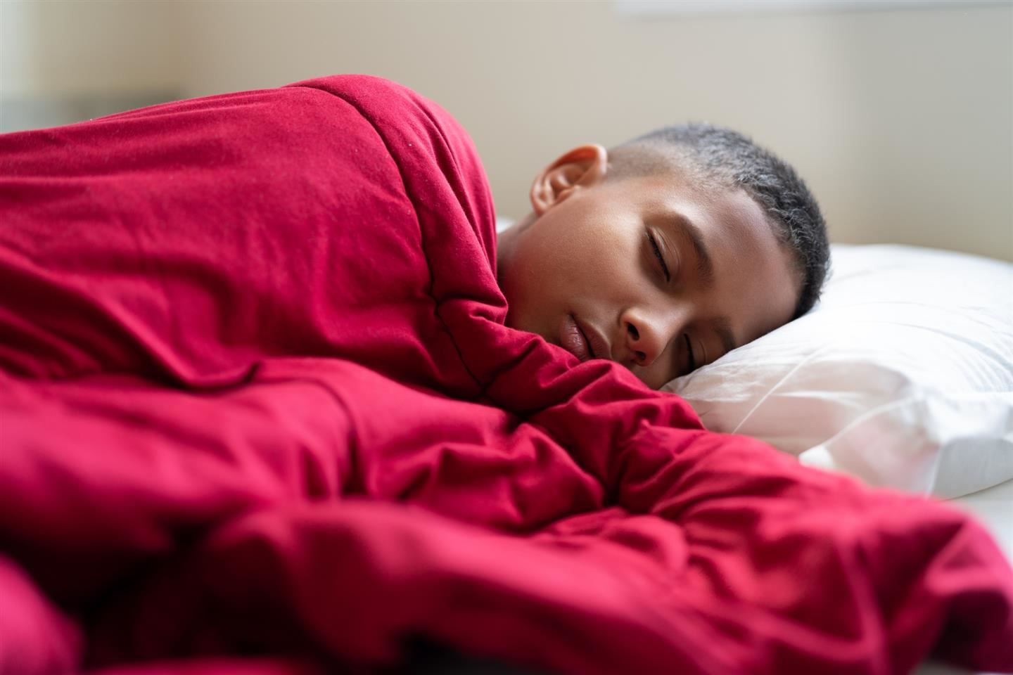  Teen sleeping in bed